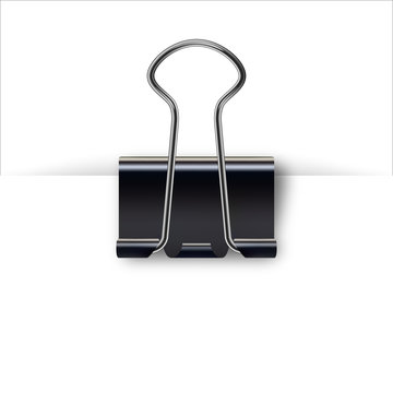 Binder clip for paper design. Realistic metallic black paper clip with shadow from a sheet of paper.