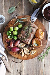 Roast beef with yorkshire pudding, brussels sprouts, porcini mushrooms and shallots. Traditional british roast beef. Overhead view