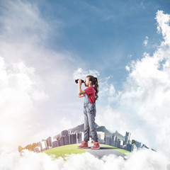 Concept of careless happy childhood with girl looking in future