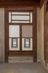 Interleaved grunge wooden window (Mashrabiya), Medieval Cairo, Egypt