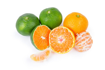 Whole, halves and segments of ripe green and orange tangerines