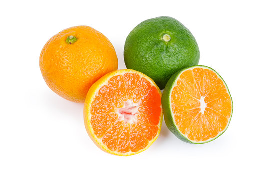 Whole and halves ripe green tangerine and ordinary mandarin orange