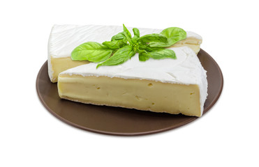 Brie cheese on brown dish on a white background