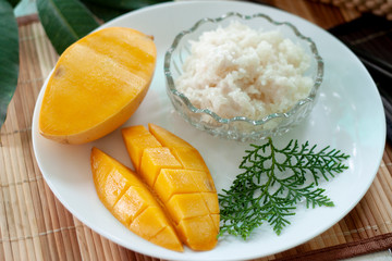 Mango with sticky rice with coconut milk is Thai style dessert.