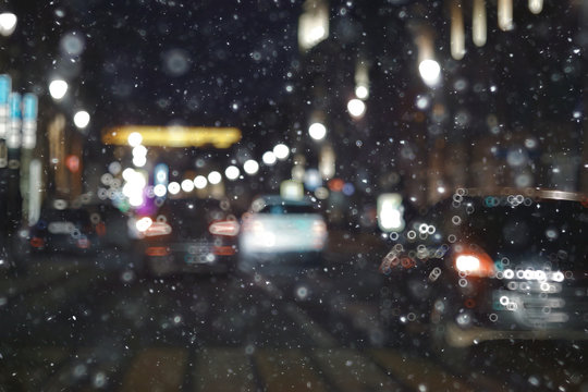 blurred transport background snow / traffic on a winter highway, seasonal auto concept, blurry auto texture, traffic jams