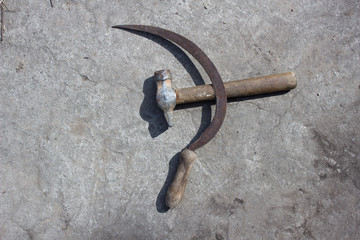 Sickle and hammer on concrete background, symbol, patriotism, cement background