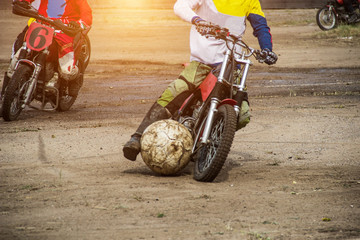 Competitions on motoball, players are furiously fighting for the ball, playing football on motorcycles, motor bicycle - obrazy, fototapety, plakaty