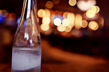 bottle of mineral water in the restaurant bokeh