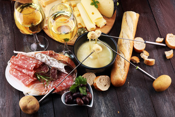Gourmet Swiss fondue dinner on a winter evening with assorted cheese