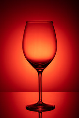 wine glass on red background