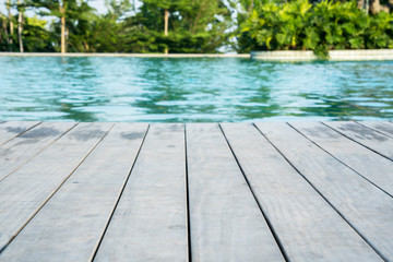 Swimming pool with poolside wooden deck