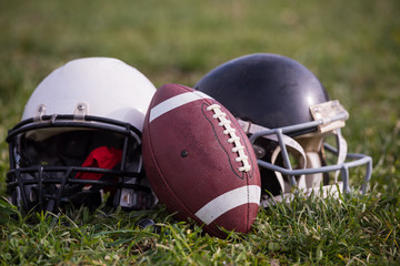 American football helmets and ball