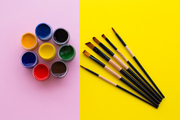 Paint, brush, pink and yellow background.