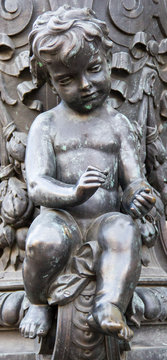 beautiful bronze angel sitting