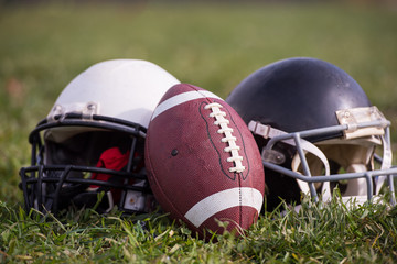 American football helmets and ball
