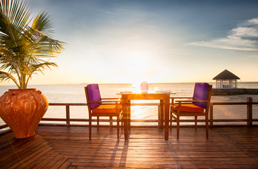 Table and chairs at restaurant at  island Olhuveli, Maldives.
