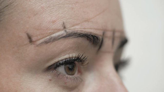 Close-Up Cosmetician Draws Lines Threads Around Client Eyebrows