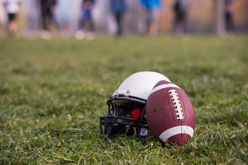 American football helmet and ball