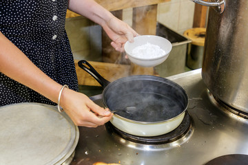 a dish is cooked in the kitchen