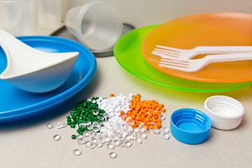 Plastic disposable tableware and Plastic Raw material. Colored granules of polyethylene,...