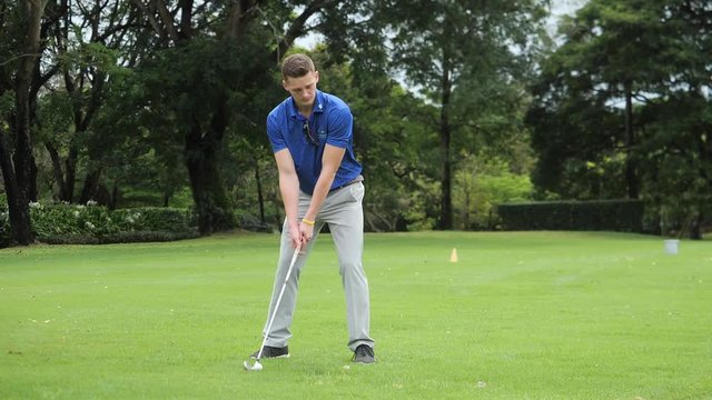 Young Man Golfer Swing golf in Slow motion
