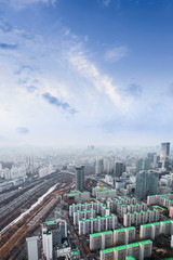 Seoul cityscapes, skyline, high rise office buildings and skyscrapers in Seoul city, winter daylight, top view in winter, Seoul, Republic of Korea, in mist winter season with blue sky and cloud