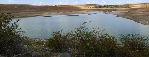 climate change and declining water dams and lakes,global warming and thirst, the dry season has reduced water levels,

