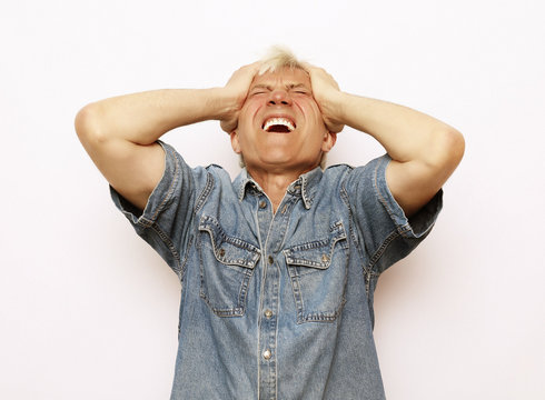 lifestyle and people concept: Scared senior man.