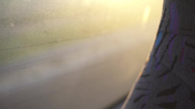 Close Up of a bus seat and a window - highway is seen in the background