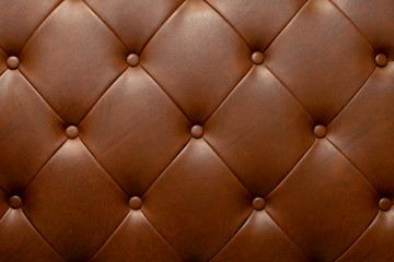 Brown genuine leather sofa background.