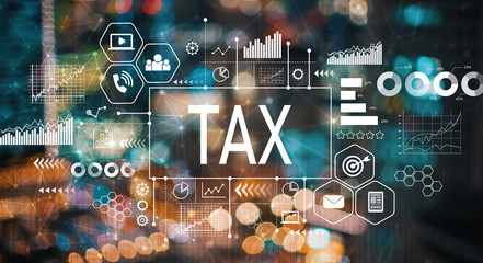 Tax with blurred city abstract lights background