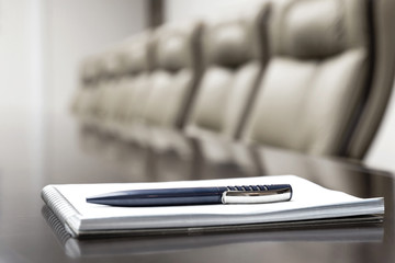 notepad on a table in conference room