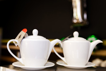two white teapot on the table