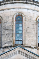 Old beautiful Windows in a large stone house.