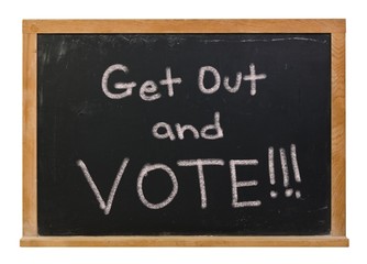 Get out and vote written in white chalk on a black chalkboard isolated on white