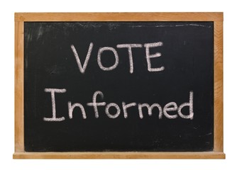 Vote informed written in white chalk on a black chalkboard isolated on white