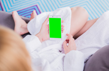 The smartphone in the hands of women