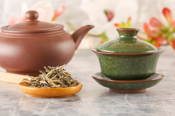 Traditional green tea, brown ceramic teapot with a cup prepared for the traditional Asian tea ceremony