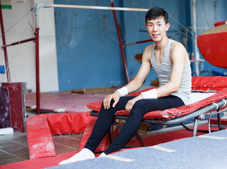 Young man resting in gym