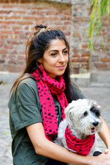 Beautiful Smiling Woman Hugging  Her Cute Havanese Dog with Red Scarf .Fashion for Owner and Dog .