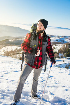 Bearded male hiker on a snowy mountain