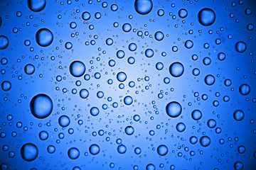fresh drops background blue glass / wet rainy background, water drops transparent glass blue