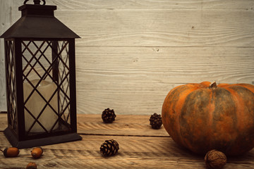 Autumn composition with pumpkin and lantern
