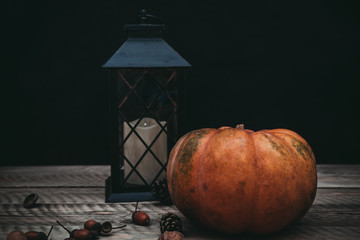 Autumn composition with pumpkin and lantern