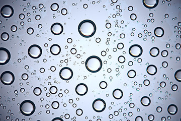fresh drops background blue glass / wet rainy background, water drops transparent glass blue