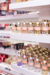 Bottles of perfume for sale on shelves