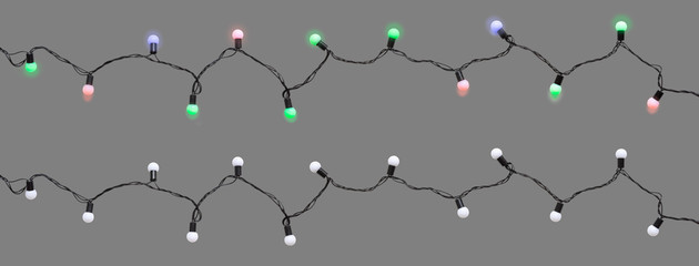Christmas led light bulbs turned on & off on string isolated on grey background (Clipping included)...