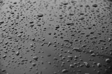 drop water in glass on black and white background