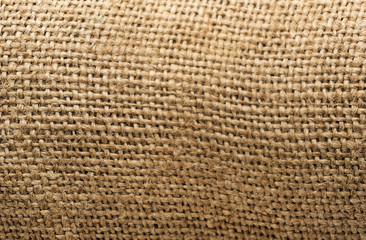 Burlap texture background closeup. tied little ropes