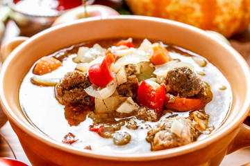 Goulash soup with fresh vegetables and meat.